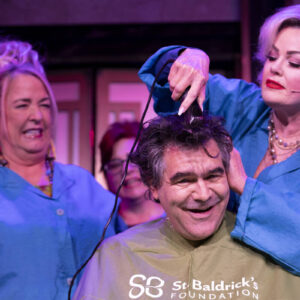 strip-favorite-‘menopause’-wields-the-clippers-for-charity